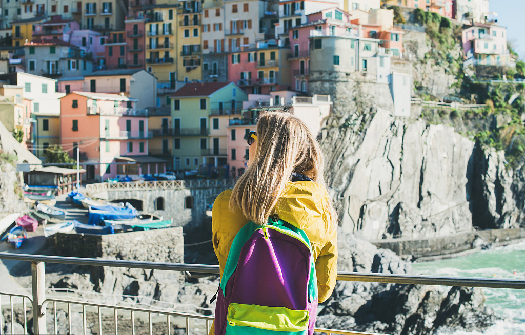 a woman travels alone and enjoys the view