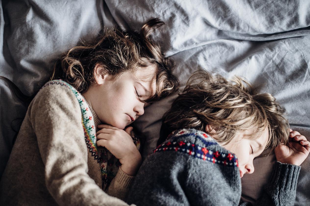 children sleep closely and peacefully