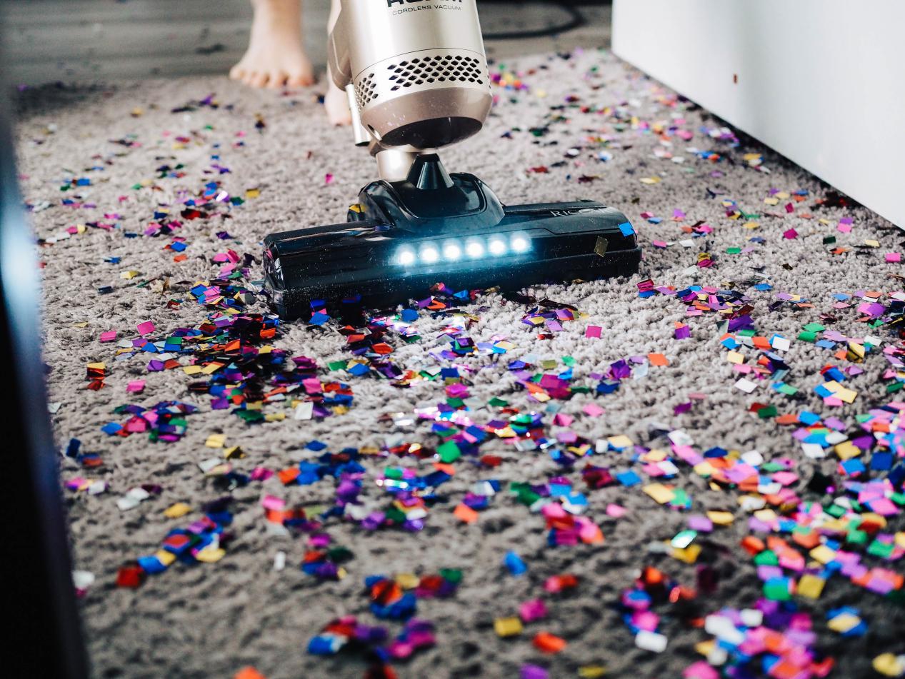 vacuum cleaner is cleaning the carpet